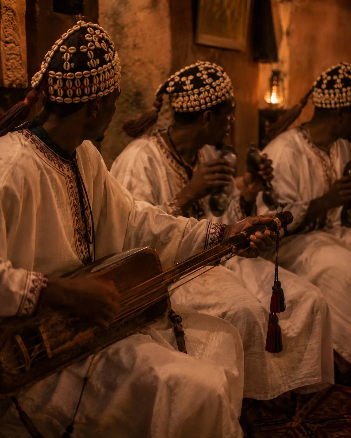 Gnawa musicians playing traditional drums